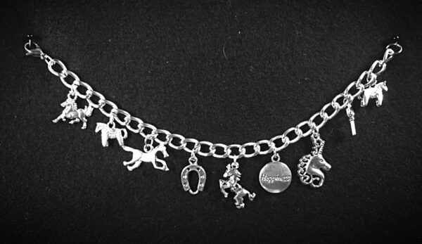 The Horse Charm Bracelet is handcrafted, celebrates the horse and has a popular word charm attached as well as a horseshoe or other good luck charm.